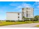 Building exterior showing landscaping and waterfront location at 6287 Bahia Del Mar Cir # 208, St Petersburg, FL 33715