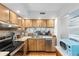 Kitchen with wood cabinets, granite counters and water views at 6287 Bahia Del Mar Cir # 208, St Petersburg, FL 33715