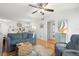 Living room features hardwood floors and access to balcony at 6287 Bahia Del Mar Cir # 208, St Petersburg, FL 33715