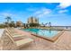 Inviting community pool with lounge chairs and waterfront views at 6287 Bahia Del Mar Cir # 208, St Petersburg, FL 33715