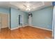 Primary bedroom with ensuite bathroom and wood flooring at 7109 Queen Palm Cir, Sarasota, FL 34243