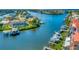 Aerial view of a waterfront community with private boat docks and lush landscaping at 808 Symphony Isles Blvd, Apollo Beach, FL 33572