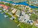 Stunning aerial shot of waterfront homes with boat docks, picturesque canals and a pool at 808 Symphony Isles Blvd, Apollo Beach, FL 33572