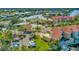 Community aerial view with vibrant waterfront homes, well-manicured landscaping, and a scenic waterway at 808 Symphony Isles Blvd, Apollo Beach, FL 33572