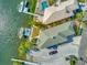 Overhead view of a home with a private boat lift providing direct access to open water at 808 Symphony Isles Blvd, Apollo Beach, FL 33572