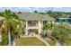Spacious backyard with a hot tub, outdoor seating, and a spiral staircase leading to a balcony, offering a perfect outdoor retreat at 808 Symphony Isles Blvd, Apollo Beach, FL 33572