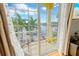 Scenic view from the balcony overlooking the canal, palm trees, and the boats at 808 Symphony Isles Blvd, Apollo Beach, FL 33572