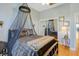 Stylish bedroom features hardwood floors, ceiling fan, and a comfortable bed with decor at 808 Symphony Isles Blvd, Apollo Beach, FL 33572