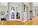Bright dining room featuring French doors, hardwood floors and views of dining room at 808 Symphony Isles Blvd, Apollo Beach, FL 33572