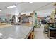 Extensive workshop garage space with an array of tools, equipment, and expansive work surfaces at 808 Symphony Isles Blvd, Apollo Beach, FL 33572