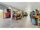 Spacious garage equipped with a variety of tools, storage solutions, and workspace areas at 808 Symphony Isles Blvd, Apollo Beach, FL 33572