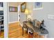 Hallway shows nice table and decor with hardwood floors at 808 Symphony Isles Blvd, Apollo Beach, FL 33572