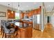 Modern kitchen features granite countertops, stainless steel appliances and an island with seating at 808 Symphony Isles Blvd, Apollo Beach, FL 33572