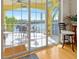 Covered patio with outdoor seating provides stunning waterfront views, perfect for relaxing and entertaining guests at 808 Symphony Isles Blvd, Apollo Beach, FL 33572