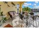 Inviting outdoor patio with comfortable seating offers stunning views of the waterway and surrounding neighborhood at 808 Symphony Isles Blvd, Apollo Beach, FL 33572