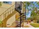 Exterior spiral staircase offering easy access to the second-floor balcony and backyard at 808 Symphony Isles Blvd, Apollo Beach, FL 33572