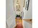 Carpeted staircase with desk and decor at the top of the landing at 808 Symphony Isles Blvd, Apollo Beach, FL 33572