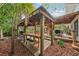 Relaxing backyard with a wooden pergola, deck, and various seating areas at 934 21St N Ave, St Petersburg, FL 33704