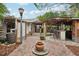 Brick patio with covered bar, deck, and lush landscaping at 934 21St N Ave, St Petersburg, FL 33704