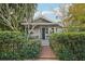 Charming house with gray siding, brick walkway, and lush landscaping at 934 21St N Ave, St Petersburg, FL 33704