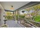 Front porch with view of neighborhood, string lights and hanging planter at 934 21St N Ave, St Petersburg, FL 33704