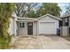 Detached garage with a long driveway and a storage area at 934 21St N Ave, St Petersburg, FL 33704