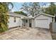 Gray house exterior with garage and covered entryway at 934 21St N Ave, St Petersburg, FL 33704