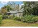Charming house exterior with a spacious lawn and lush landscaping at 934 21St N Ave, St Petersburg, FL 33704