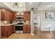 Modern kitchen with dark wood cabinets, granite countertops, and stainless steel appliances at 934 21St N Ave, St Petersburg, FL 33704