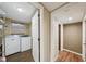 Laundry room with washer, dryer, and storage shelving at 934 21St N Ave, St Petersburg, FL 33704