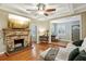 Bright living room with hardwood floors, stone fireplace, and sectional sofa at 934 21St N Ave, St Petersburg, FL 33704