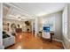 Spacious living area with hardwood floors, fireplace, and built-in workspace at 934 21St N Ave, St Petersburg, FL 33704