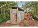 Wooden shed with various signs and a baseball bat at 934 21St N Ave, St Petersburg, FL 33704