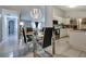 Dining area with glass table and modern chandelier at 10114 Chimney Hill Ct, Tampa, FL 33615