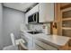 Small galley kitchen with microwave and sink at 10114 Chimney Hill Ct, Tampa, FL 33615