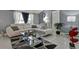 Living room with white sectional sofa and glass coffee table at 10114 Chimney Hill Ct, Tampa, FL 33615