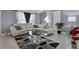 Living room with white sectional sofa and glass coffee table at 10114 Chimney Hill Ct, Tampa, FL 33615