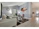 Open living room and kitchen with white sectional sofa at 10114 Chimney Hill Ct, Tampa, FL 33615