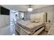 Main bedroom with large bed and small kitchenette at 10114 Chimney Hill Ct, Tampa, FL 33615
