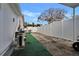Side yard with AC unit, partial artificial turf, and privacy fence at 10114 Chimney Hill Ct, Tampa, FL 33615
