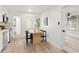 Light and bright dining area with wood table and four black chairs at 10233 108Th Ave, Largo, FL 33773