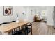 View of dining area and living room with beige couch at 10233 108Th Ave, Largo, FL 33773