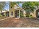 Private screened patio and backyard with tropical landscaping at 1050 Starkey Rd # 2701, Largo, FL 33771