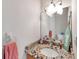 Bathroom with granite vanity and updated light fixture at 1050 Starkey Rd # 2701, Largo, FL 33771