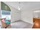 Bright bedroom with ceiling fan, carpet, and ensuite bathroom access at 1050 Starkey Rd # 2701, Largo, FL 33771