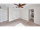 Cozy bedroom with ceiling fan and access to bathroom at 1050 Starkey Rd # 2701, Largo, FL 33771
