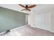 Spacious bedroom with ceiling fan and double-door closet at 1050 Starkey Rd # 2701, Largo, FL 33771