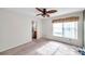 Bright bedroom with ceiling fan, carpet, and ensuite bathroom at 1050 Starkey Rd # 2701, Largo, FL 33771
