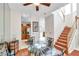 Charming dining area with glass top table and kitchen views at 1050 Starkey Rd # 2701, Largo, FL 33771