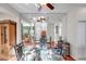 Bright dining area with mirrored wall and hardwood floors at 1050 Starkey Rd # 2701, Largo, FL 33771